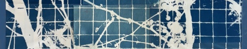 white vines moving across a grid of small blue squares
