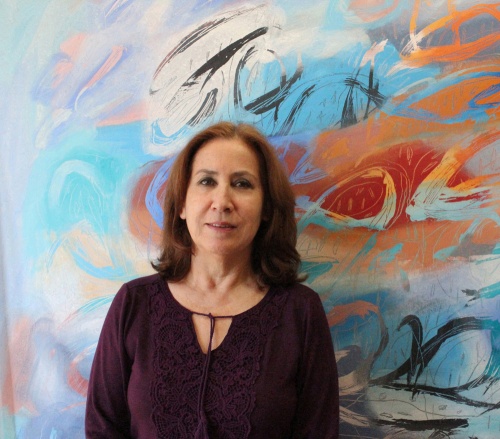  Jacqueline Unanue artist and one of her paintings in Ancient Land